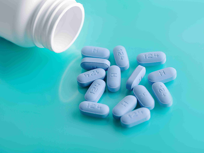 Open bottle of prescription pills to prevent HIV.
