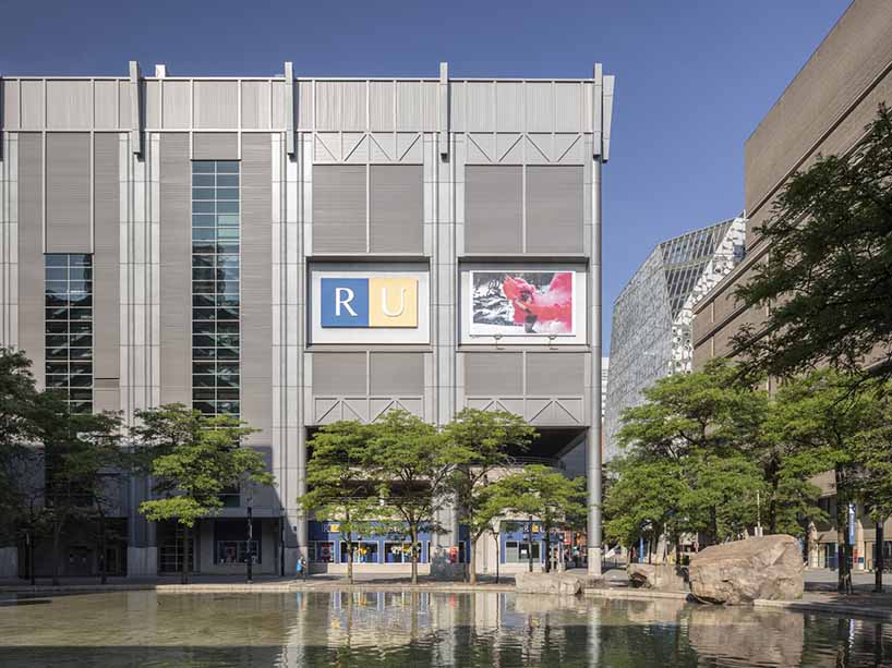 Photo of building with Ryerson University logo and photo of woman in pink smoke.