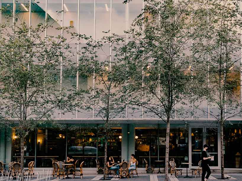 People sit at tables outside Balzacs cafe