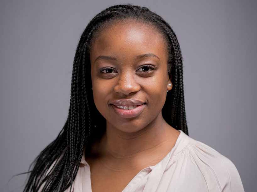 Headshot photo of Ruvimbo Musiyiwa wearing a white shirt.