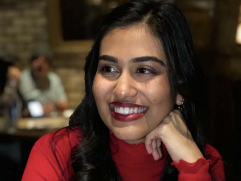 Photo of Shubhangi Joshi wearing a red shirt.