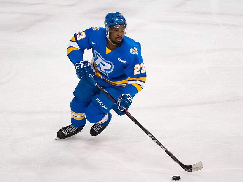 Elijah Roberts skates with the puck 