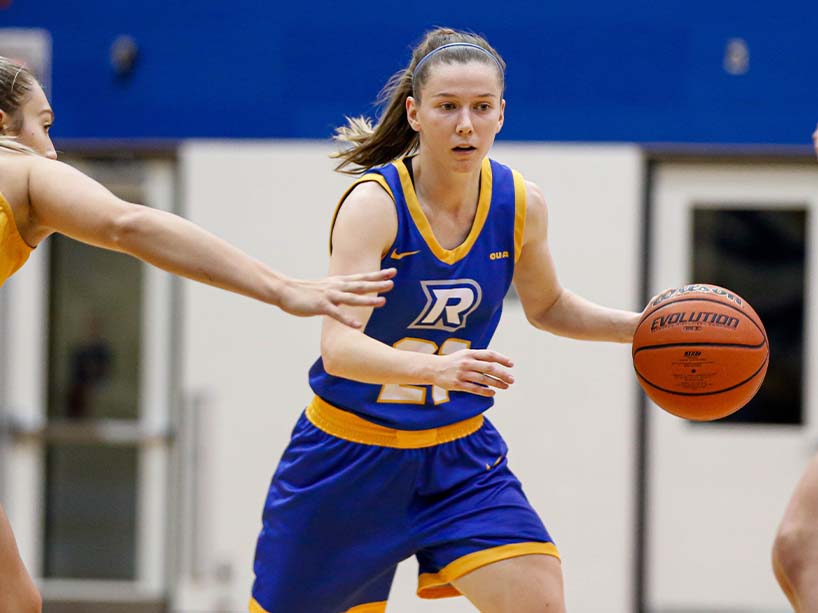 Mikaela Dodig runs with a basketball