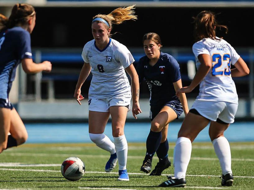 Female soccer players on the field. 