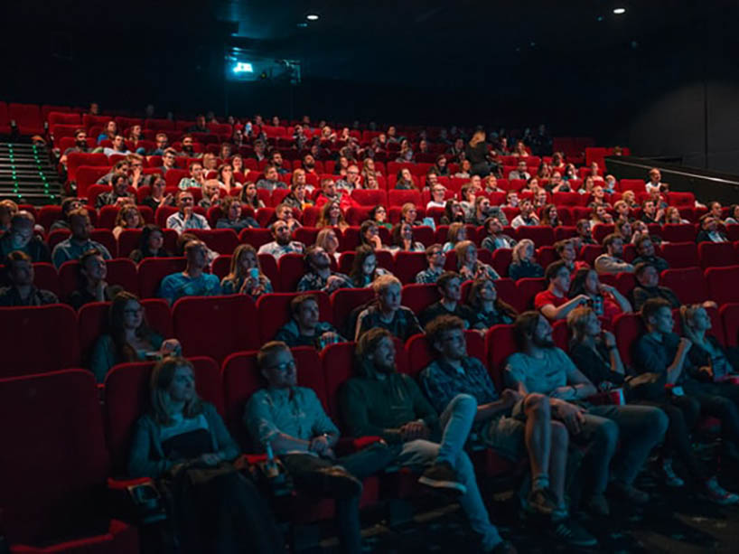 People sitting in a movie theatre.