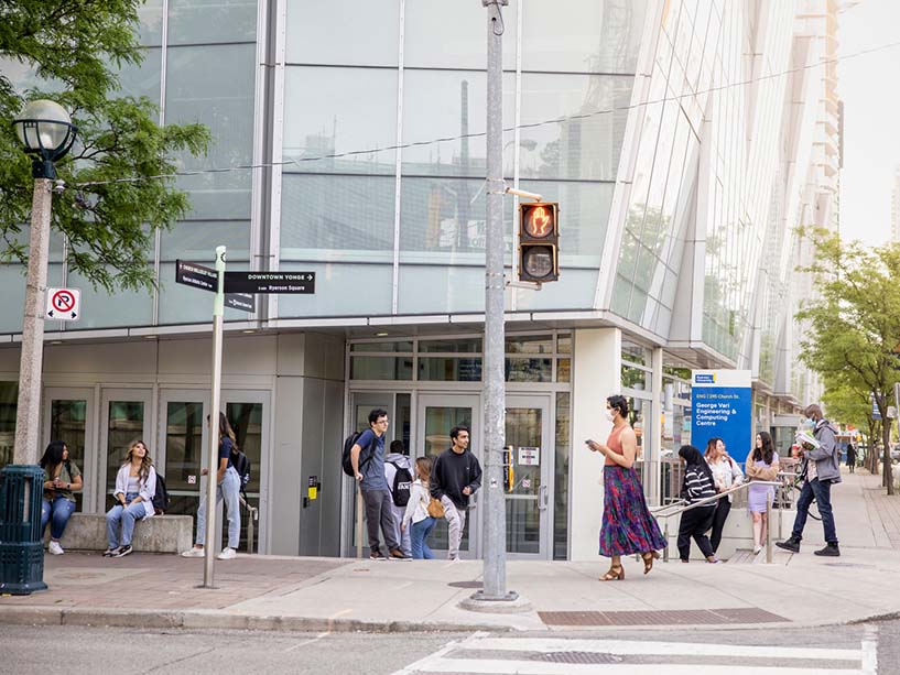 Students walking and congregating outside of the George Vari Engineering and Computing Centre. 