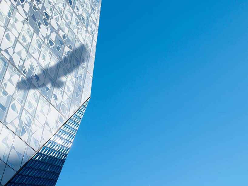 The shadow of a falcon on TMU’s Student Learning Centre.