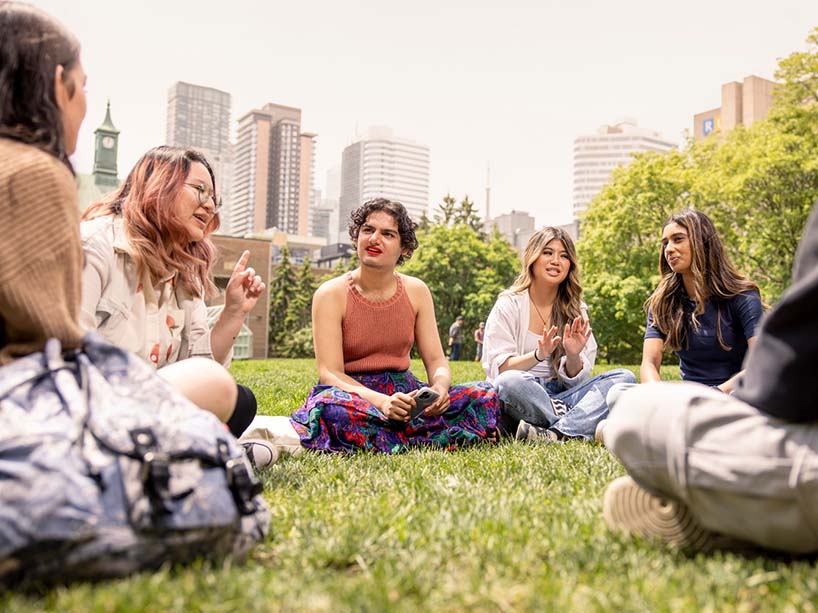 Students sitting at the quad.