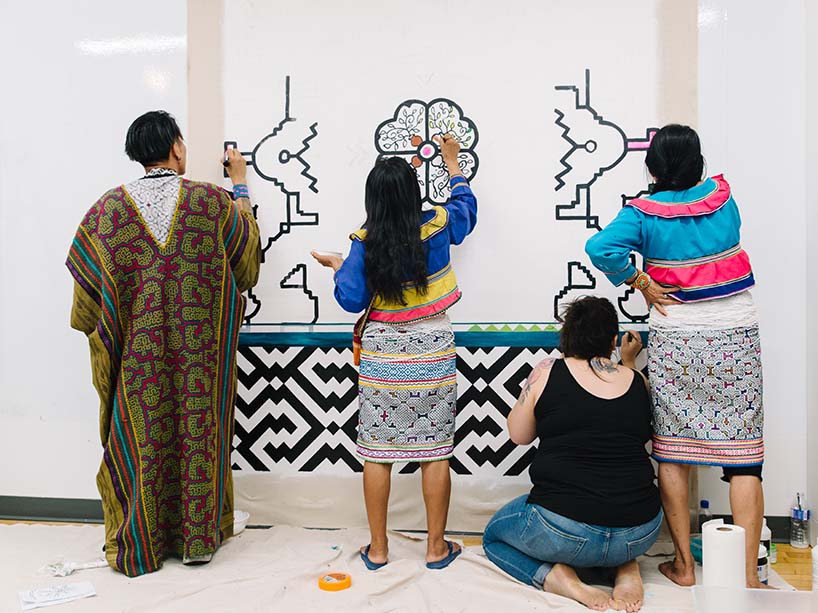 Indigenous artists creating mural