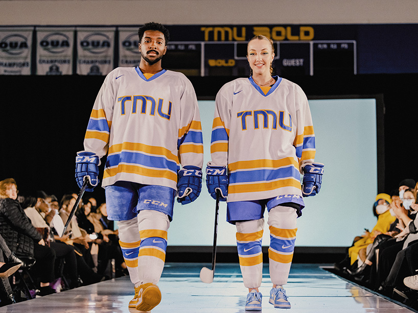 Two students in hockey equipment