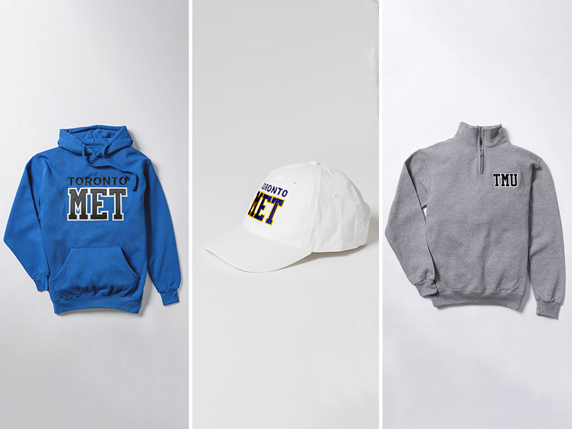 From left: Blue hoodie with “Toronto MET”, white ball cap with Toronto Met, grey zip-up with TMU signage. 