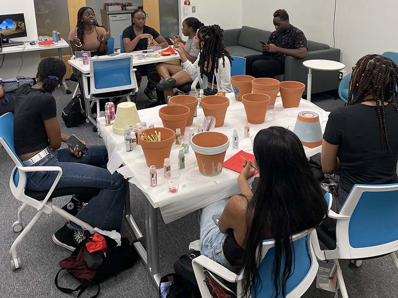 Students gathered around a table.