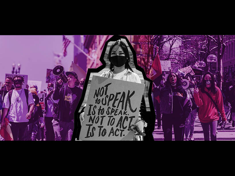 Anti-racism protestors marching. One holds a placard reading ‘Not to speak is to speak. Not to act is to act’.