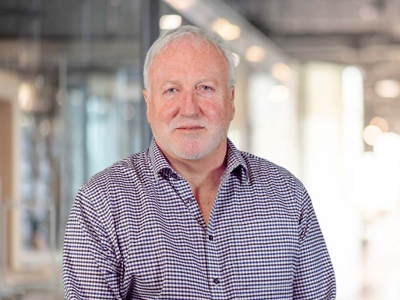 Bob Burrows in a checkered dress shirt. Photo credit: Jaye Huynh.