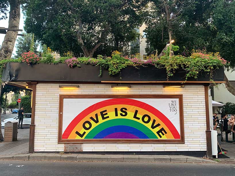 Building with a painted rainbow and the words ‘Love is love’. 