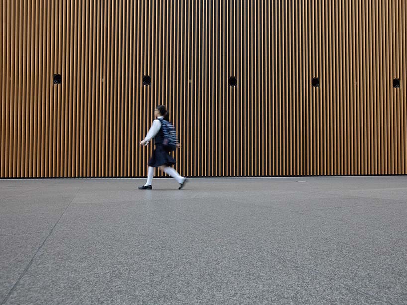 a child walks with a backpack on