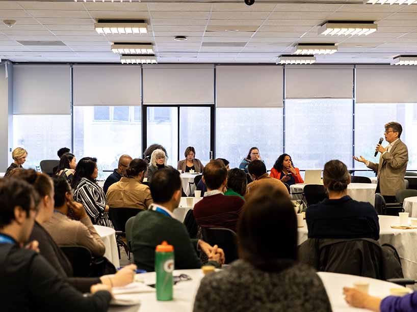 TMU community members sit at tables at a meeting to discuss Recommendation Nine from the Standing Strong Task Force.