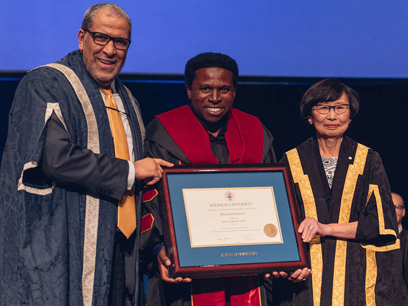 TMU President and Vice-Chancellor Mohamed Lachemi, Honorary Doctorate recipient and Canadian Football Hall of Famer Michael “Pinball” Clemons and Chancellor Janice Fukakusa.