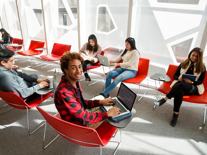  A group of students sitting at the SLC. 