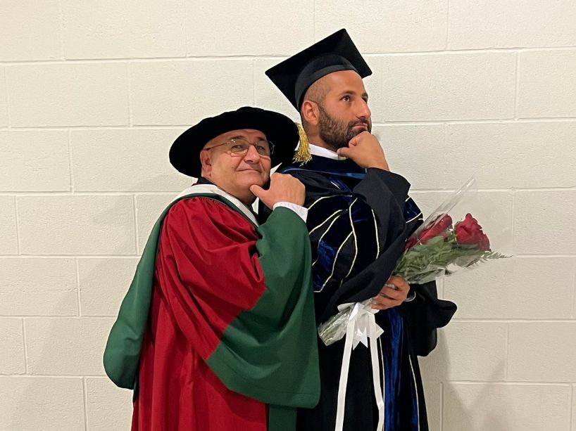 Mehrab Mehrvar and his son in their academic regalia. 