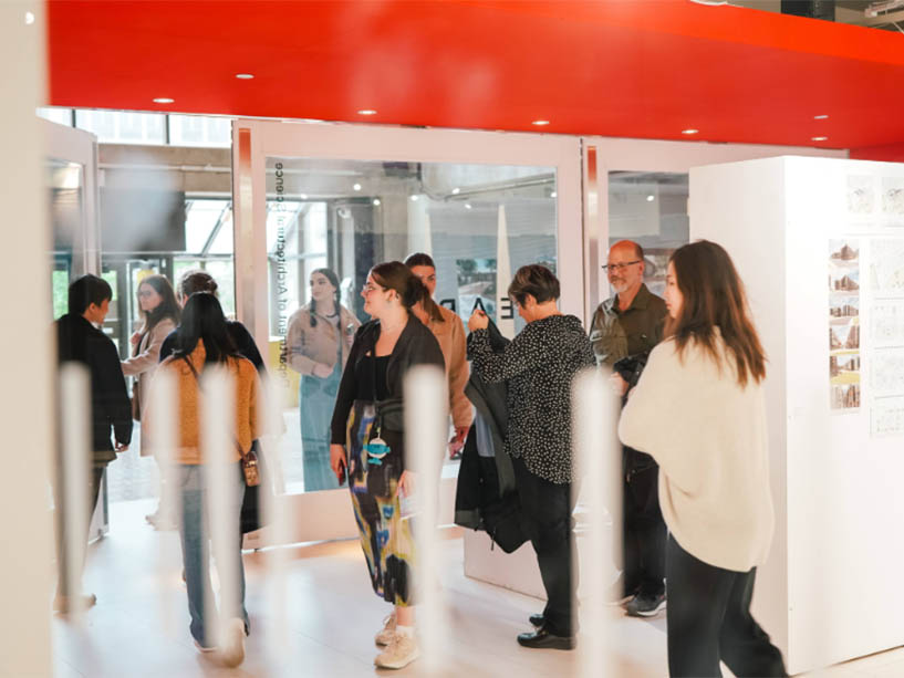 People walking through an exhibit. 