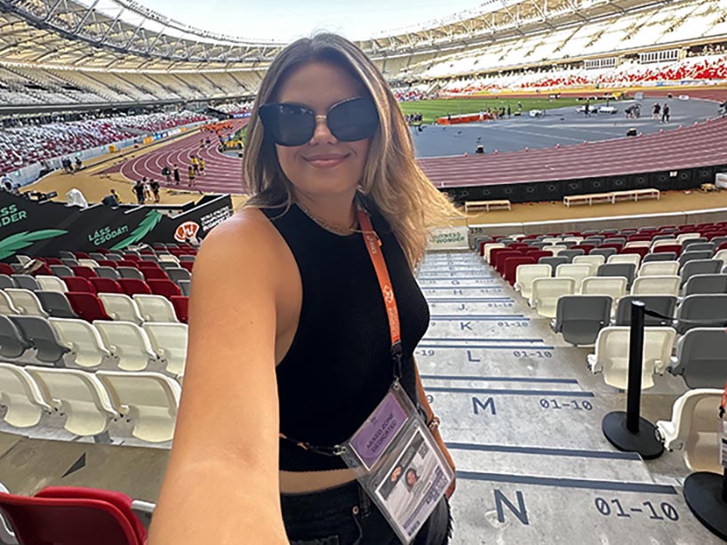 Sarah Jenkins takes a selfie in a stadium at the World Athletics Championships in Eugene in 2022.