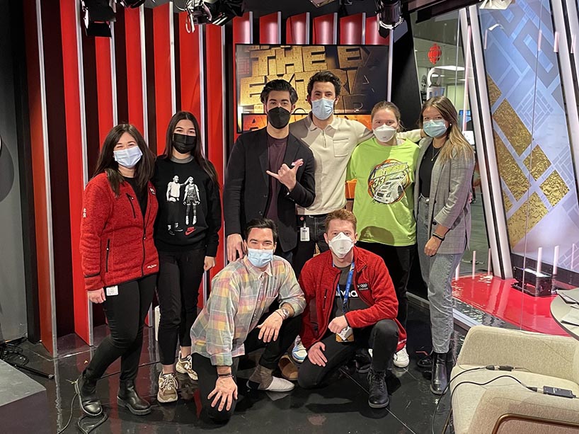 Sarah Jenkins in a group photo with the Extra Hour team (everyone in masks) from Beijing 2022. 