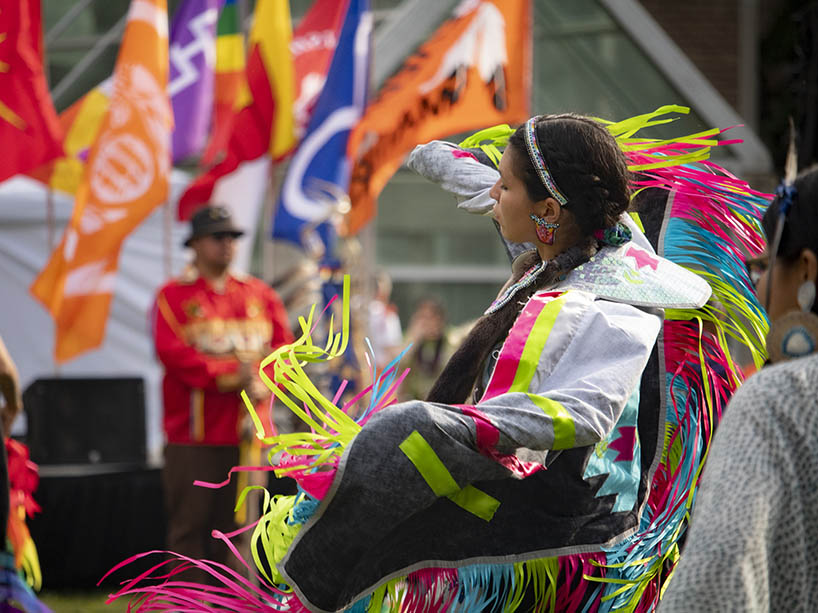Indigenous dancer in regalia.