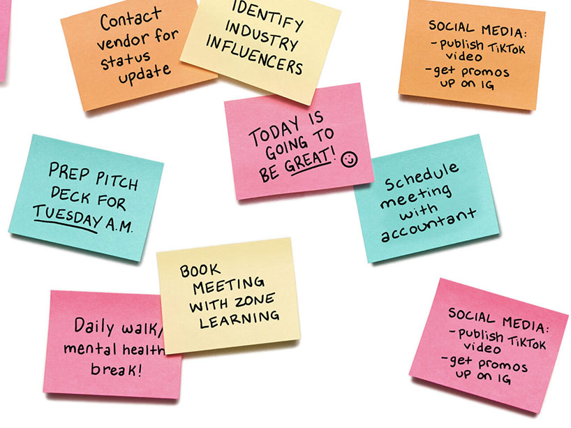 A group of post-its with reminders on them. 