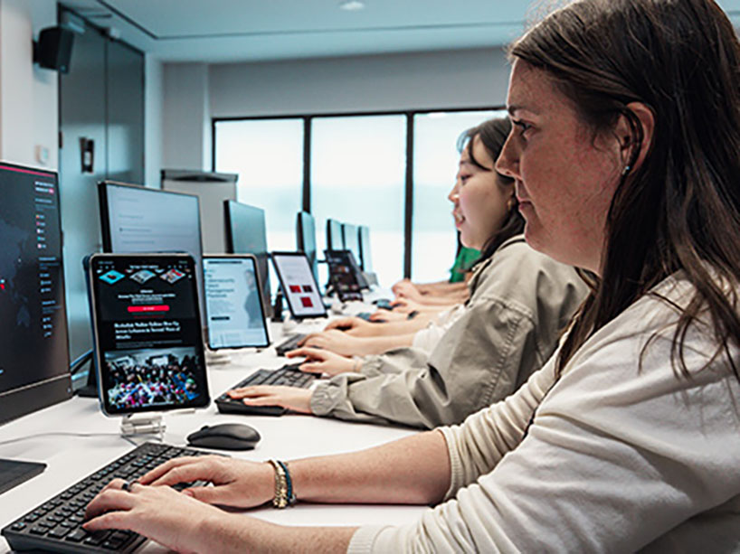 People work on computers