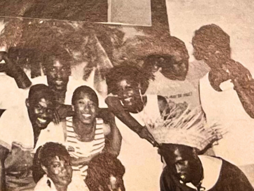 Yasmine Aarons-Pennyman surrounded by colleagues at the JCA.