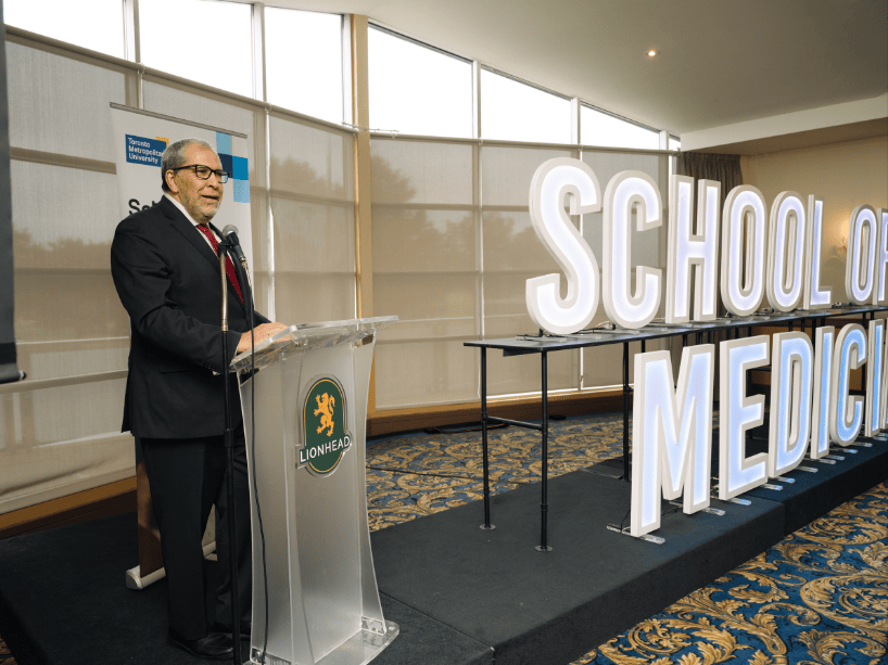  A man speaking at a podium.