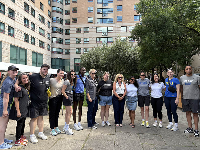 A group of people pose for a photo. 