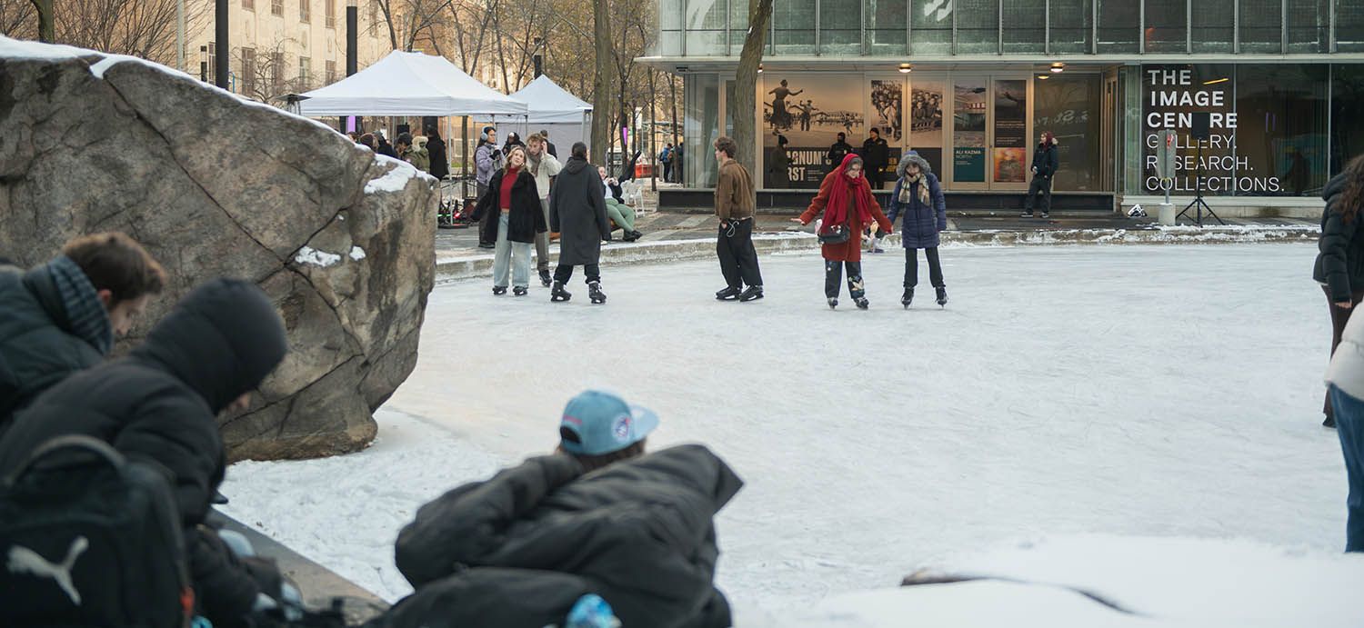 Community members skating on campus.