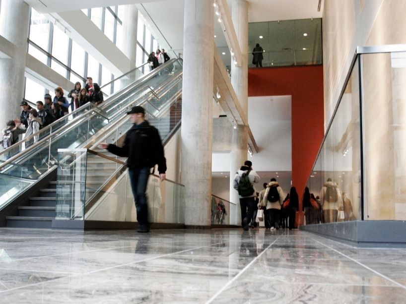 Students walk through a busy Ted Rogers School of Management building.