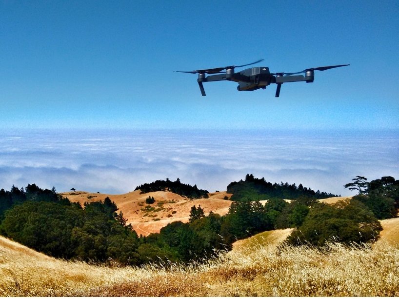Drone flying over rural landscape. 
