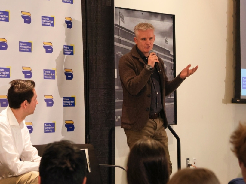 Rick Westhead speaks on stage.