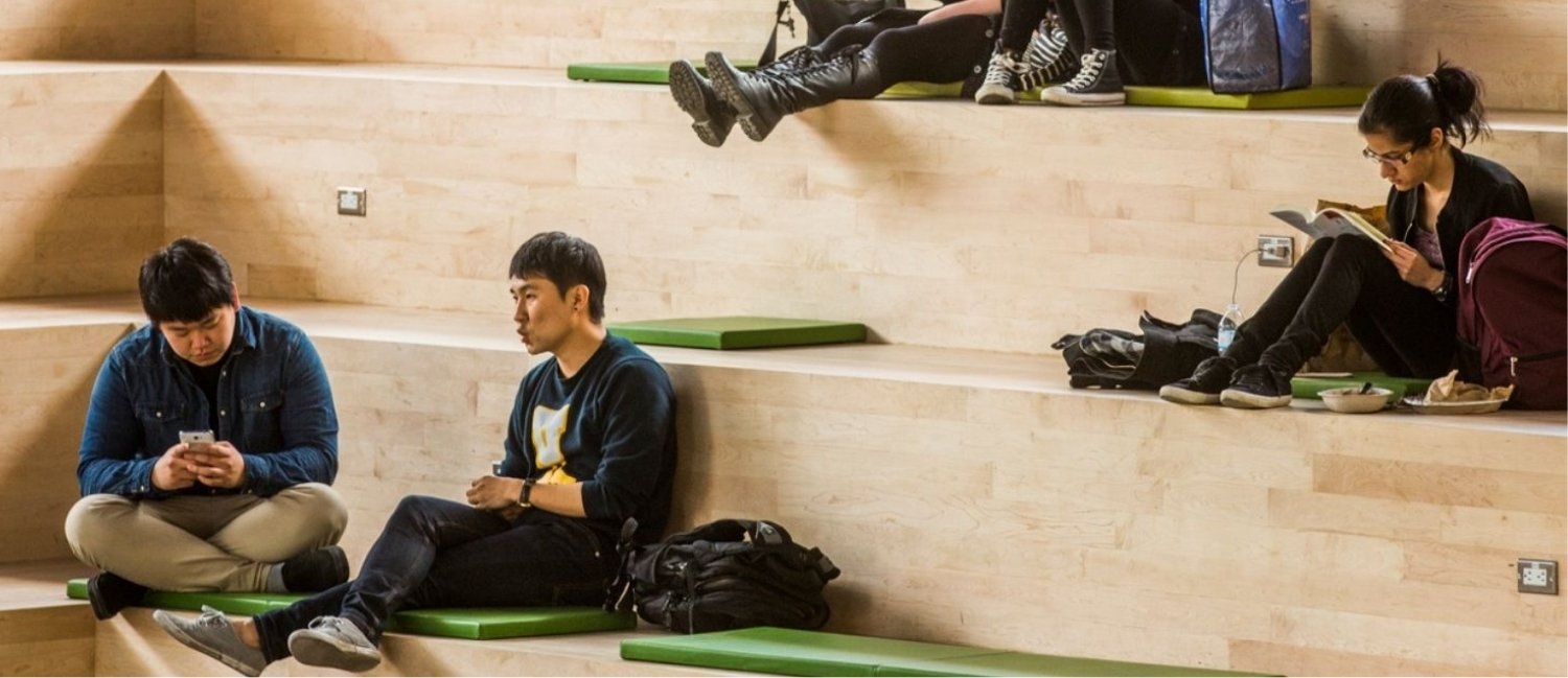 Students sit chatting in the Student Learning Centre at TMU.