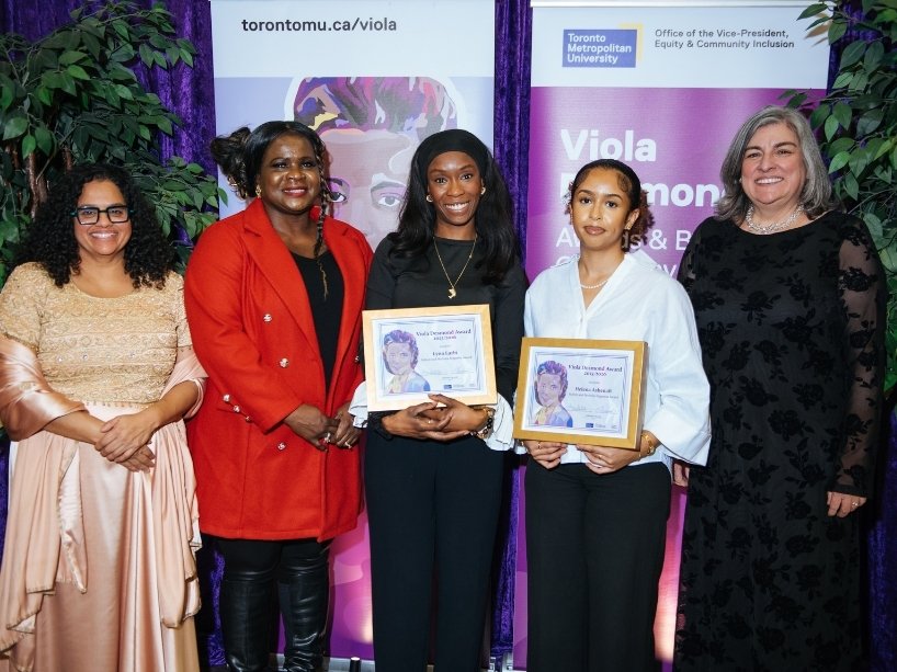 Group of women pose together at the Viola Desmond Awards with the two award winners.