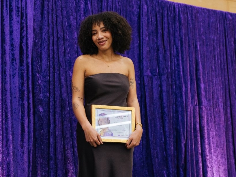 Zoë Walwyn poses with her award. 