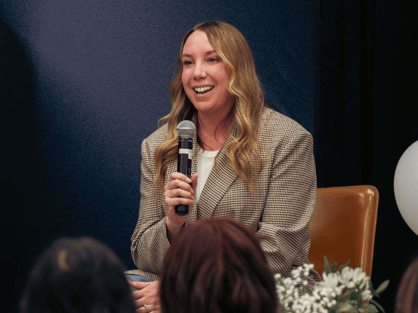 Kathleen Hegarty holding microphone.