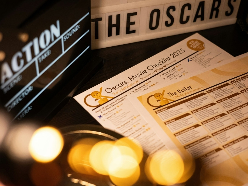 Gold lights next to a paper that says 'Oscars movie checklist' and 'the ballot'. 