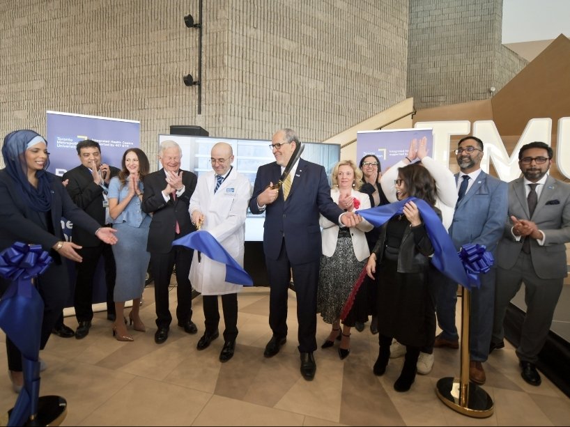TMU leaders along with 407 ETR executive team members participate in a ceremonial ribbon cutting to officially open the new Integrated Health Centre.