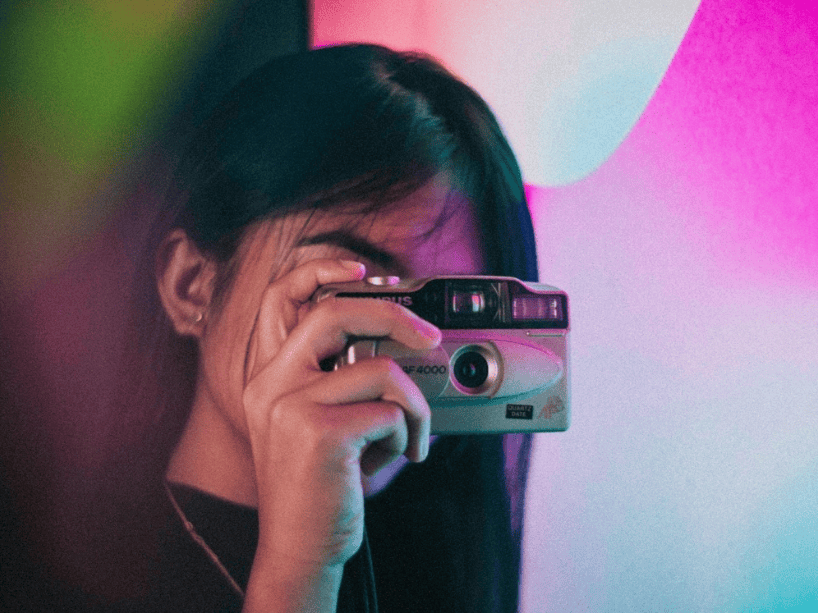Woman holding a camera.