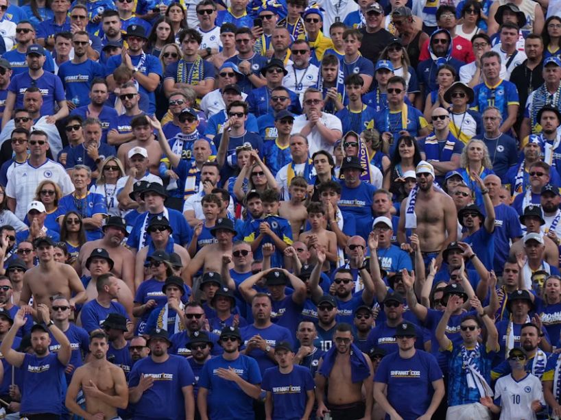 A group of fans in the stands.