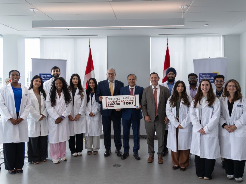 TMU medical students pose for a picture with Mohamed Lachemi, MP Ali and Mayor Brown.
