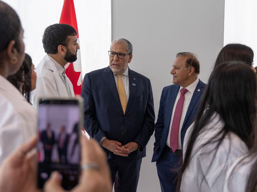 TMU medical students chat with TMU President Lachemi and MP Ali.