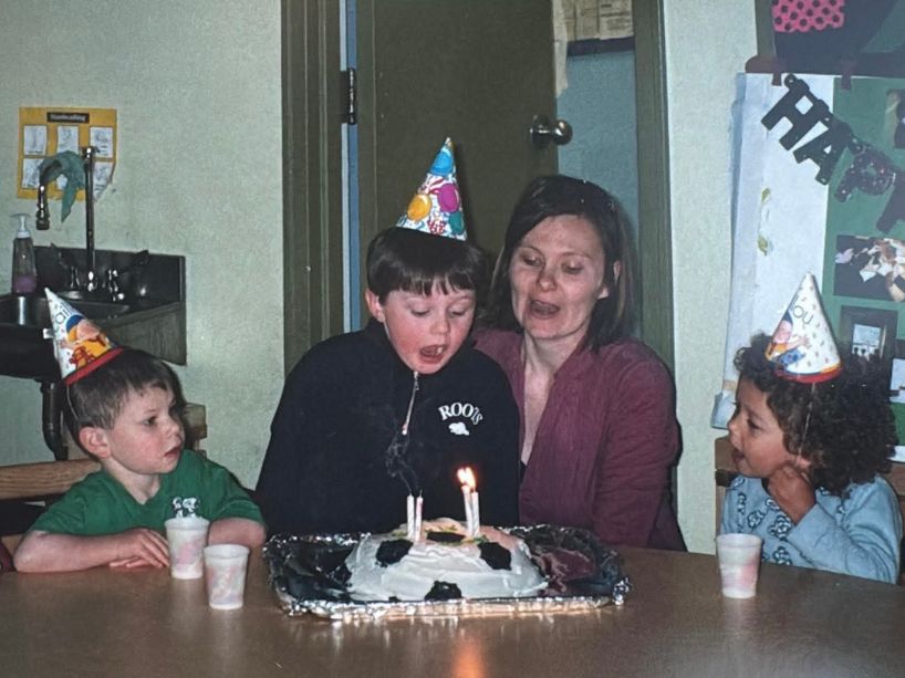 Children and teacher celebrating a birthday.