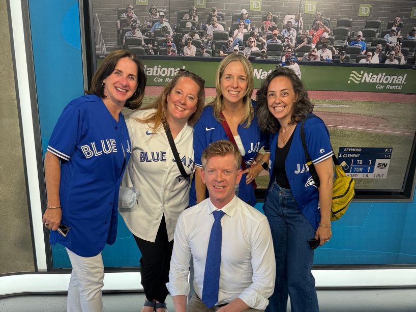 Jennifer and her colleagues pose with Jamie Campbell.