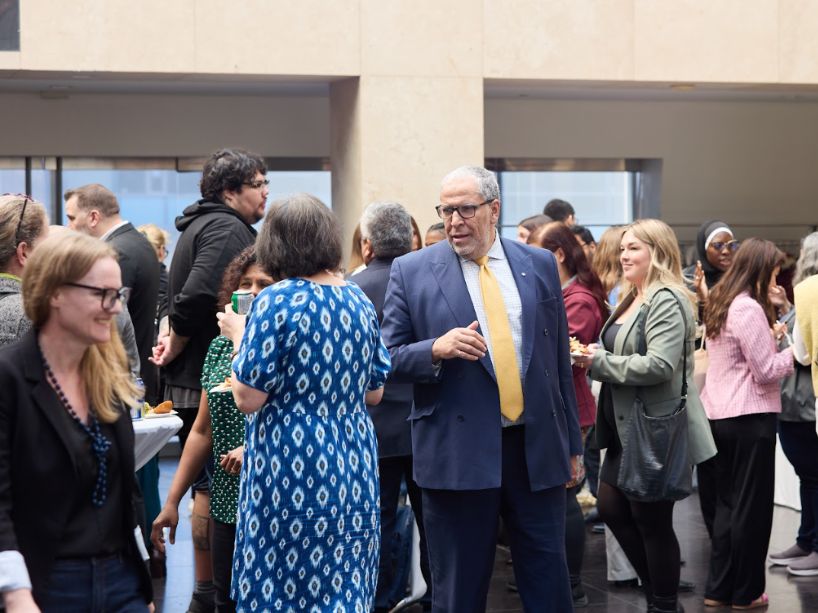 President Mohamed Lachemi mingles with guests at the event.
